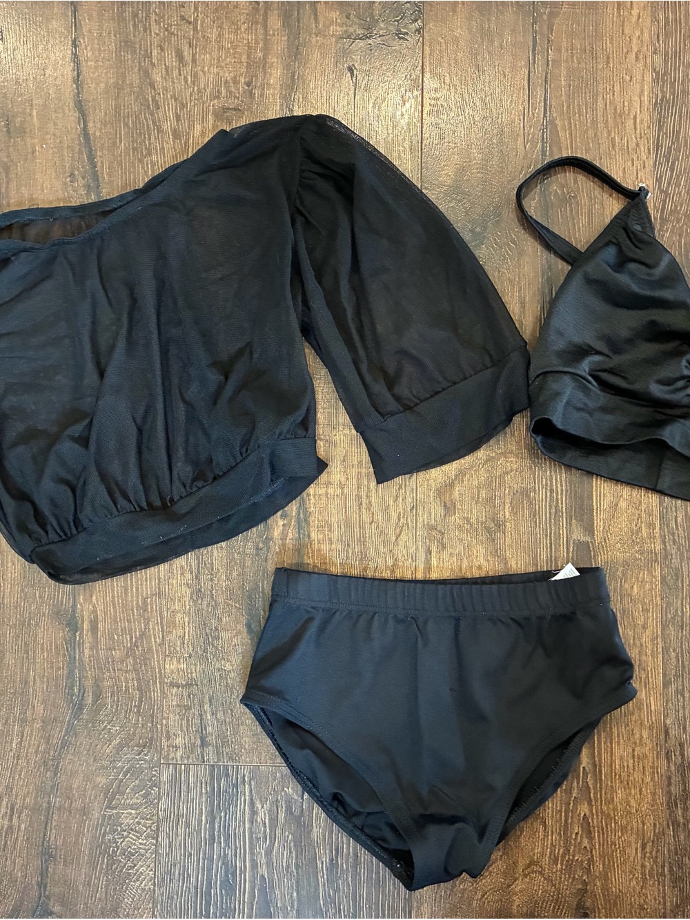 Kelle size Teen black top and sheer overlay, child large black capezio briefs